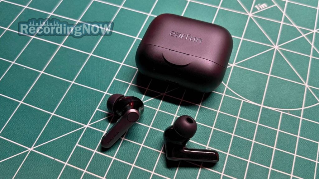 EarFun Air Pro 4+ earbuds next to charging case on desk