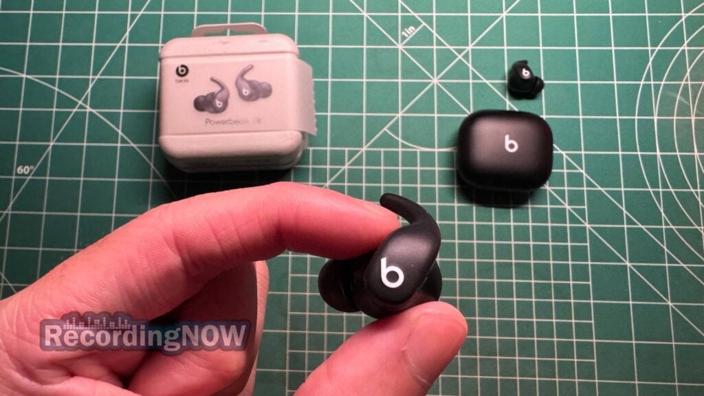 blog-img-1693067280109 Holding Beats Powerbeats Fit earbud in hand