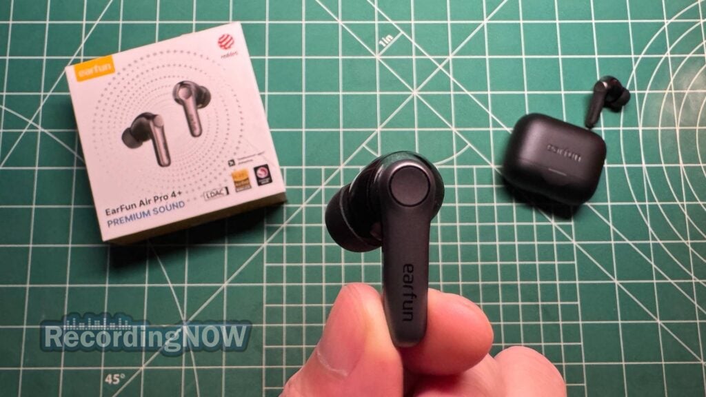 Holding EarFun Air Pro 4 Plus wireless noise cancelling earbuds in hand