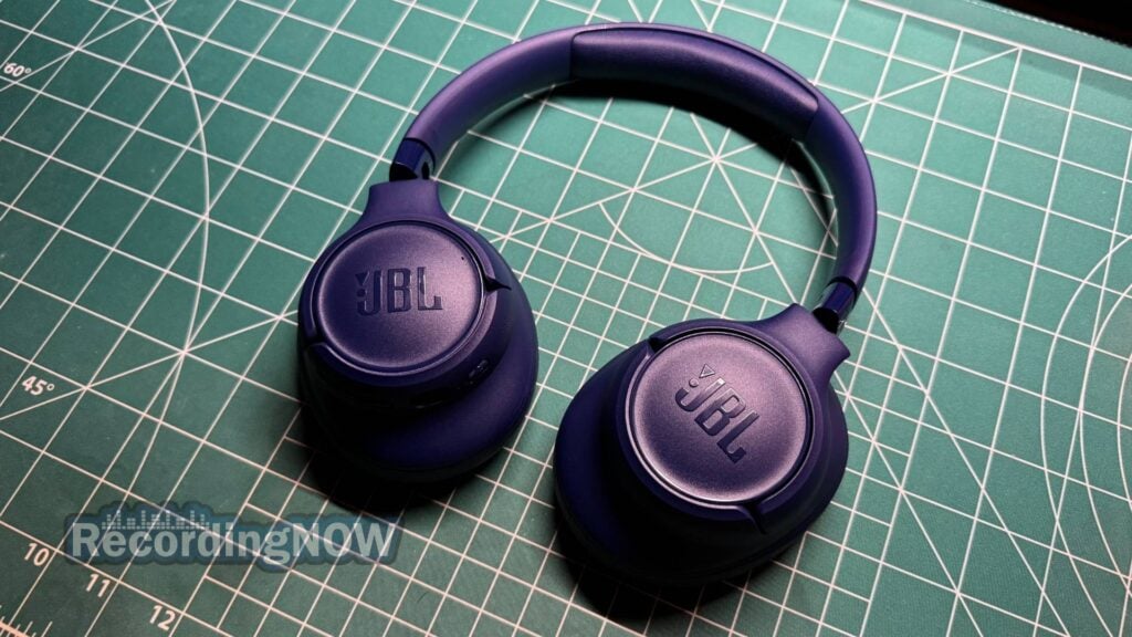 JBL Tune 730BT over-ear headphones in blue on desk