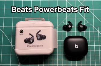 Beats Powerbeats Fit wireless noise cancelling earbuds next to original box packaging