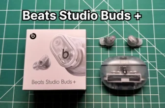 Beats Studio Buds Plus + wireless noise cancelling earbuds in Transparent color next to original box packaging