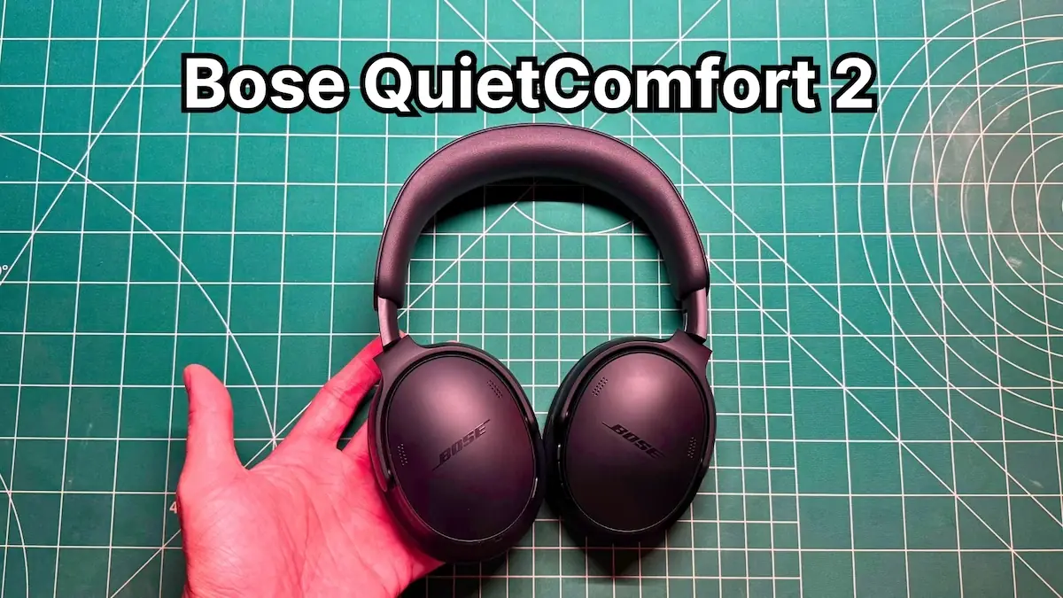 Holding Bose QuietComfort 2nd Gen Wireless Noise Cancelling Headphones