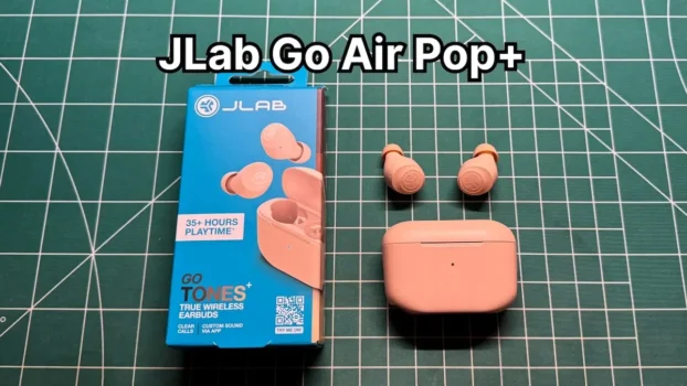 JLab Go Air Pop+ earbuds next to charging case and original box packaging