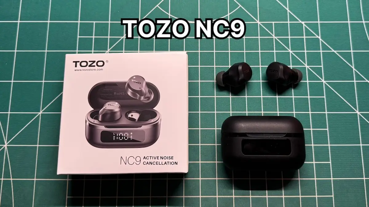 TOZO NC9 wireless noise cancelling earbuds next to charging case and original box packaging