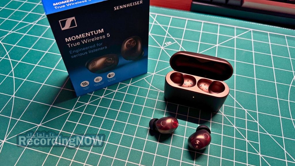 Sennheiser Momentum 5 earbuds next to original box packaging