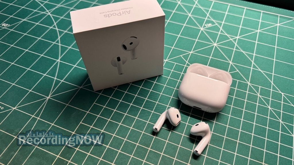 AirPods 5 earbuds and charging case next to box