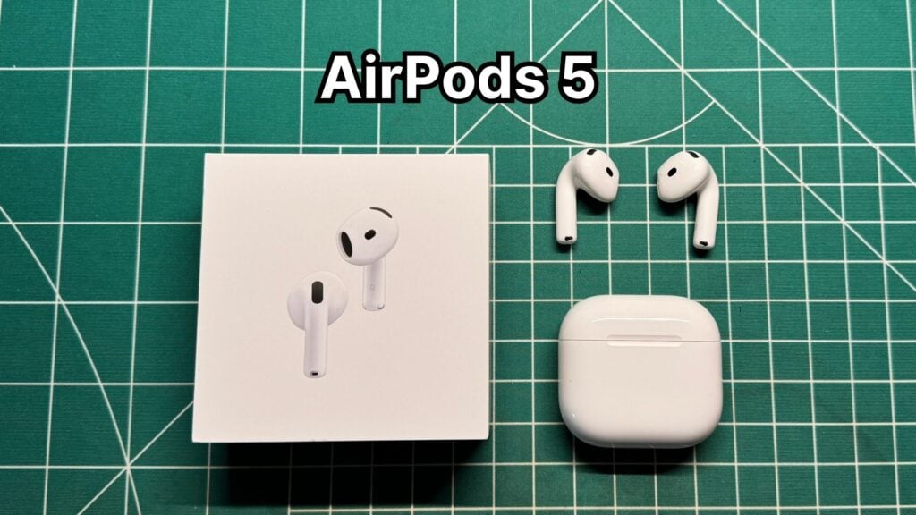 Apple AirPods 5 with Wireless Charging Case next to original box packaging