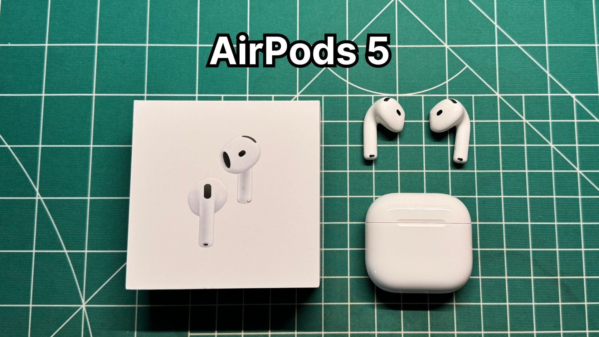 Apple AirPods 5 with Wireless Charging Case next to original box packaging