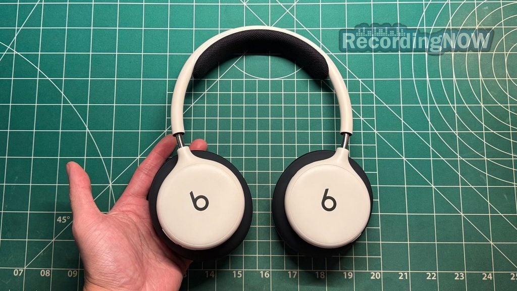 blog-img-1708892563107 Holding Beats 360 headphones in hand
