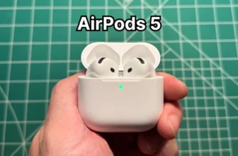 Holding Apple AirPods 5 with Wireless Charging Case in hand