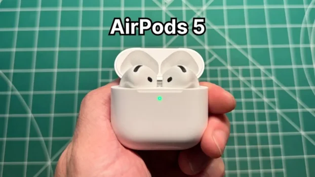 Holding Apple AirPods 5 with Wireless Charging Case in hand