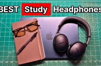 Bose wireless over-ear noise cancelling headphones next to glasses, notebook, and Macbook