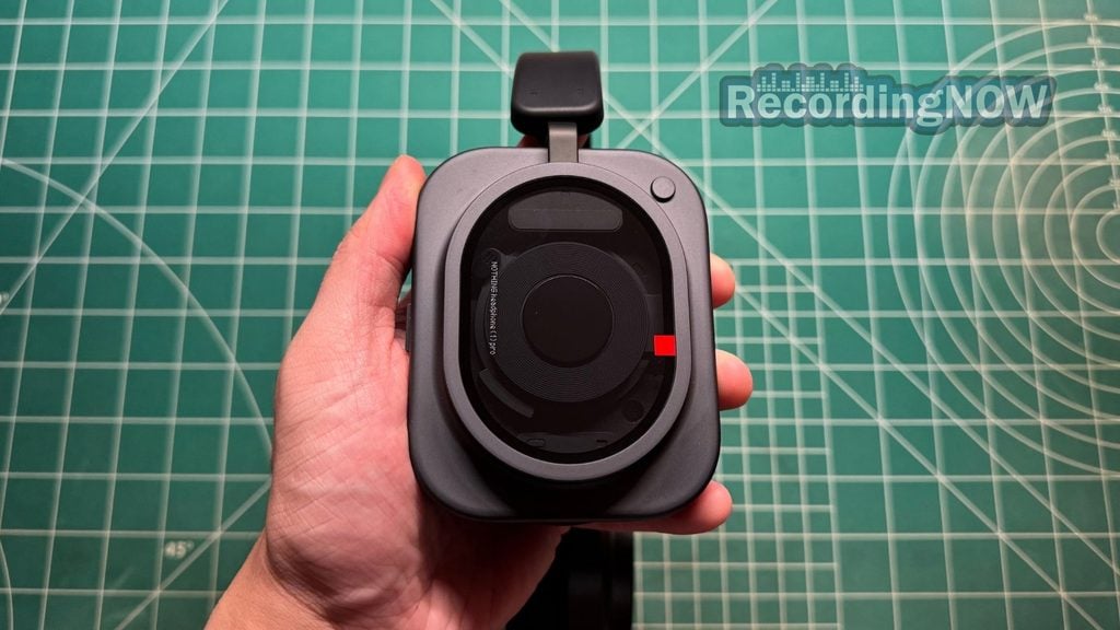 Holding earcup of Nothing Headphone (1) Pro headphones in hand