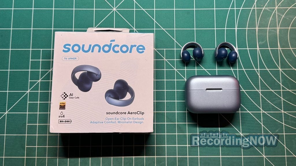 Anker Soundcore AeroClip open ear clip on earbuds next to charging case and box