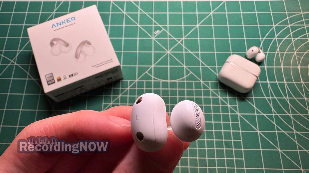 Holding Anker Soundcore AeroClip 2 wireless clip on earbud in hand