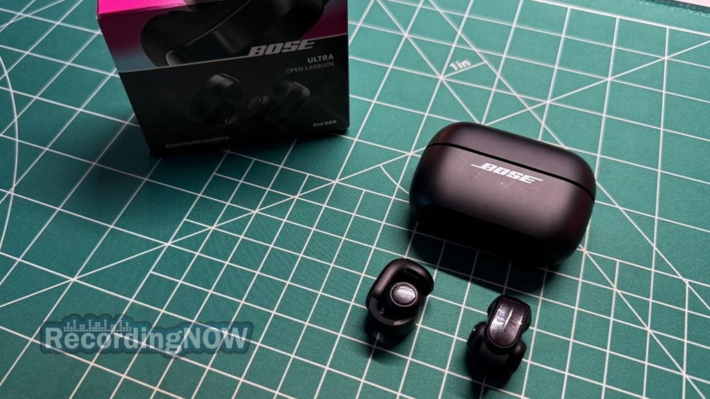 Bose Ultra Open Earbuds 2nd gen open ear clip on earbuds and charging case next to original box packaging