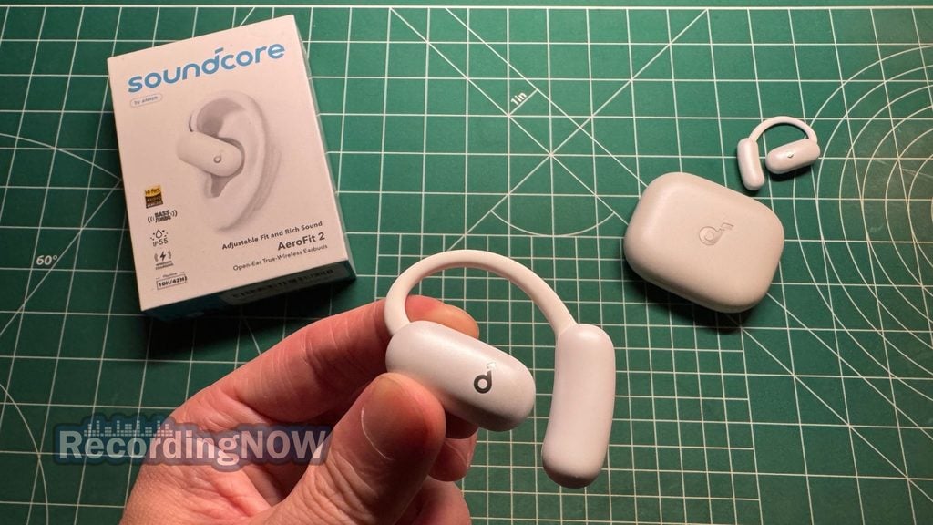 Holding Anker Soundcore AeroFit 2 wireless open ear earbud in hand