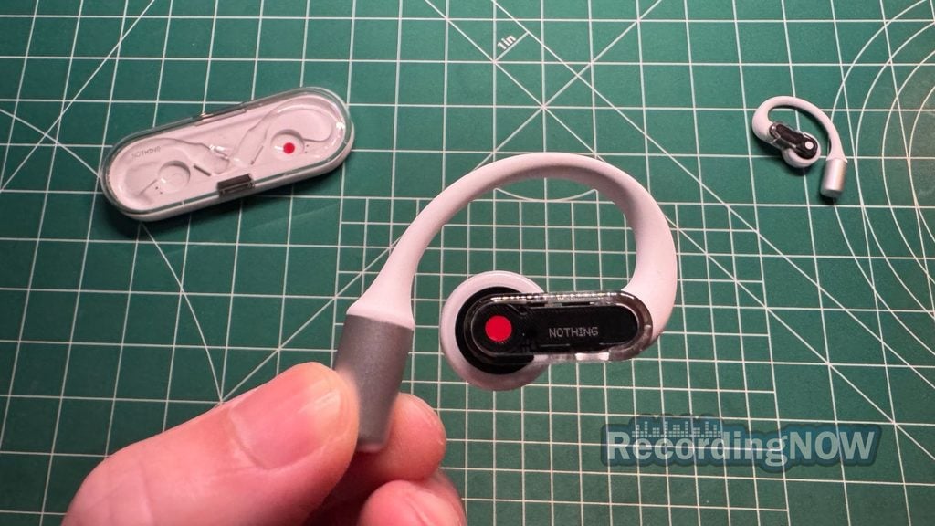 Holding Nothing Ear (Open) wireless open ear earbud in hand