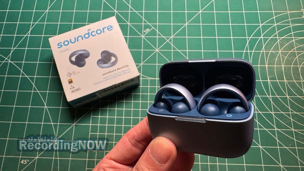 Holding Soundcore AeroClip charging case in hand