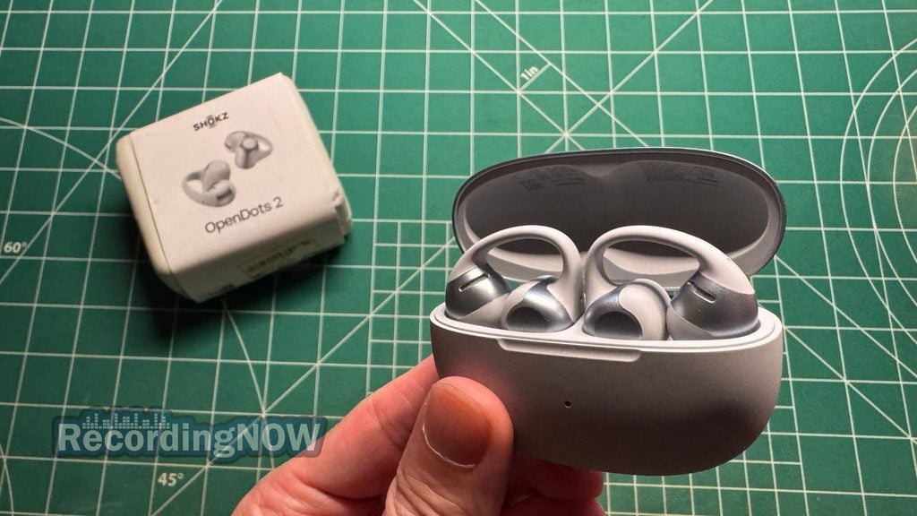 blog-img-1693070240787 Holding SHOKZ OpenDots 2 charging case in hand