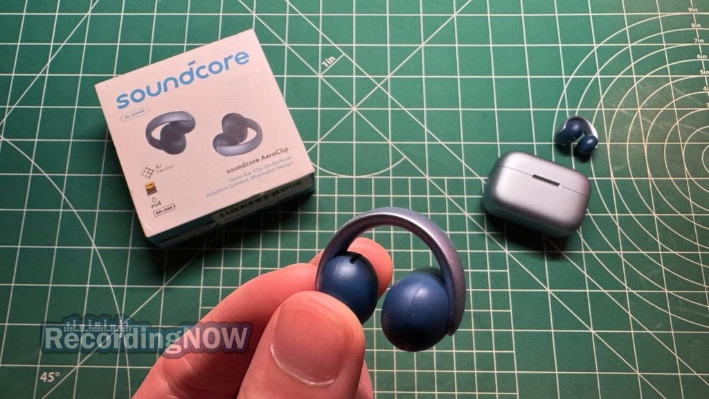 Holding Anker Soundcore AeroClip wireless clip on earbud in hand