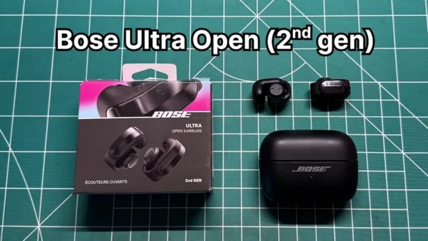 Bose Ultra Open Earbuds 2nd Gen in black next to charging case and box