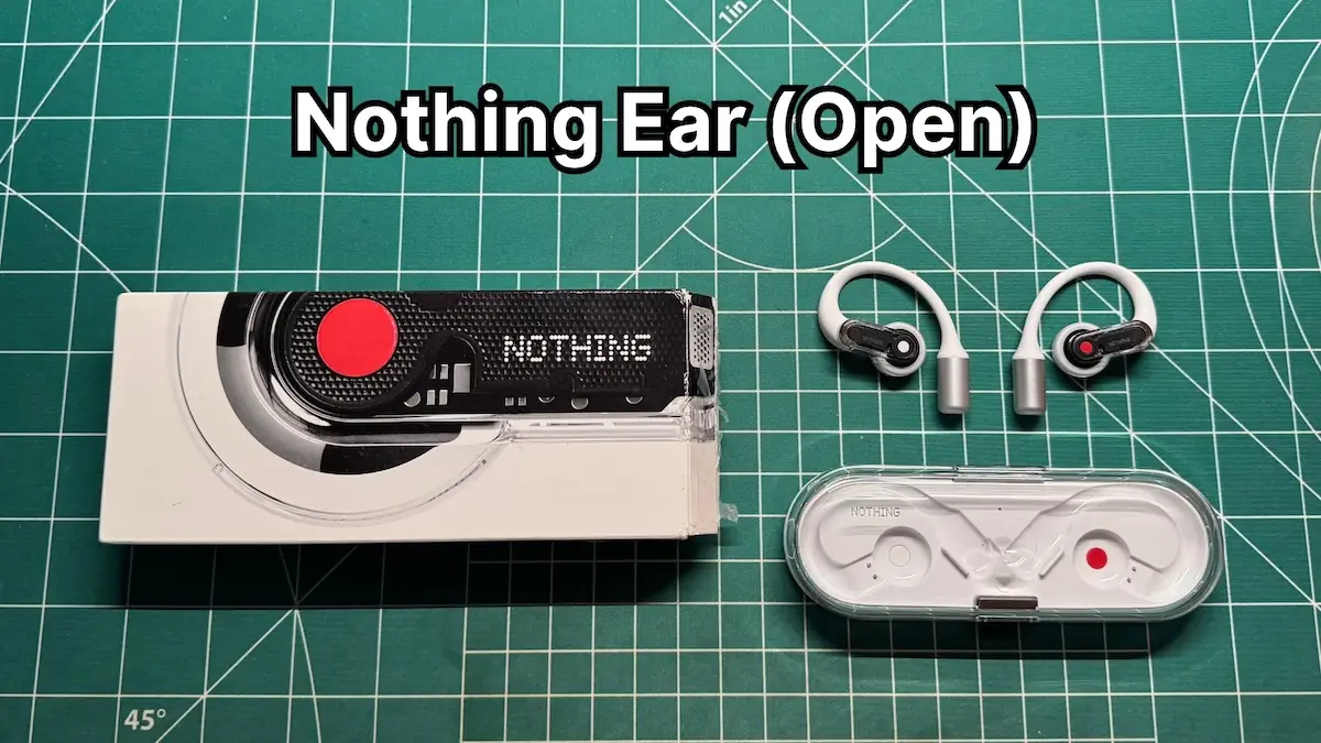 Nothing Ear (Open) open ear earbuds next to charging case and box