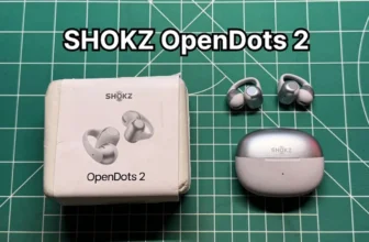 SHOKZ OpenDots 2 clip on open ear earbuds next to charging case and box