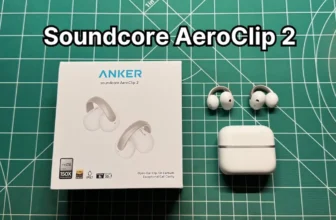 Anker Soundcore AeroClip 2 open ear clip on earbuds next to charging case and box