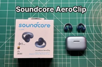 Anker Soundcore AeroClip open ear clip on wireless earbuds next to charging case and original box packaging