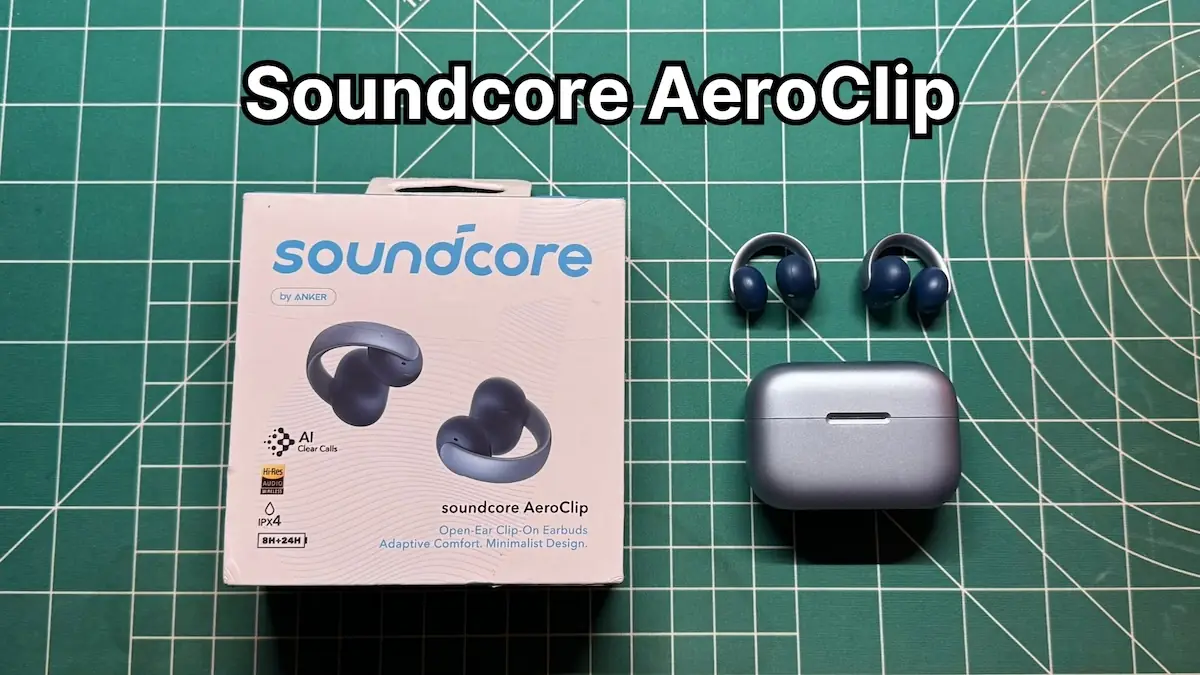 Anker Soundcore AeroClip open ear clip on wireless earbuds next to charging case and original box packaging